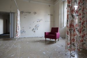 Abandoned chair and tattered curtains ward Royal Hospital Haslar Gosport History Naval Navy Military Hospital Urbex Adam X Urban Exploration Infiltration Access 2015 Abandoned decay lost forgotten derelict