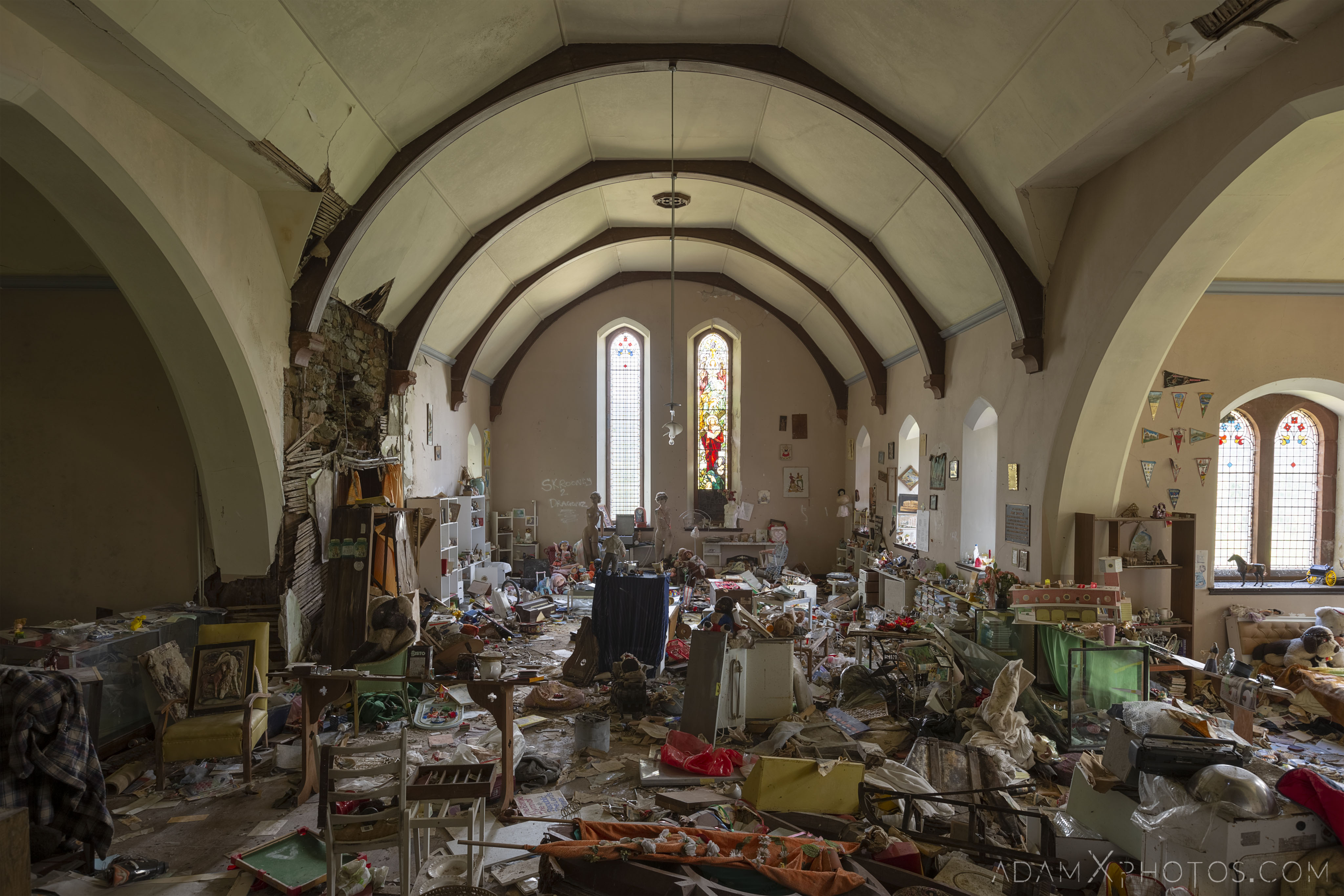main hall bed soft toys ornaments books stained glass windows Elvanfoot Parish Church Hoarder Hoarders Church Adam X Urbex Urban Exploration Access 2018 Abandoned decay lost forgotten derelict location creepy haunting eerie