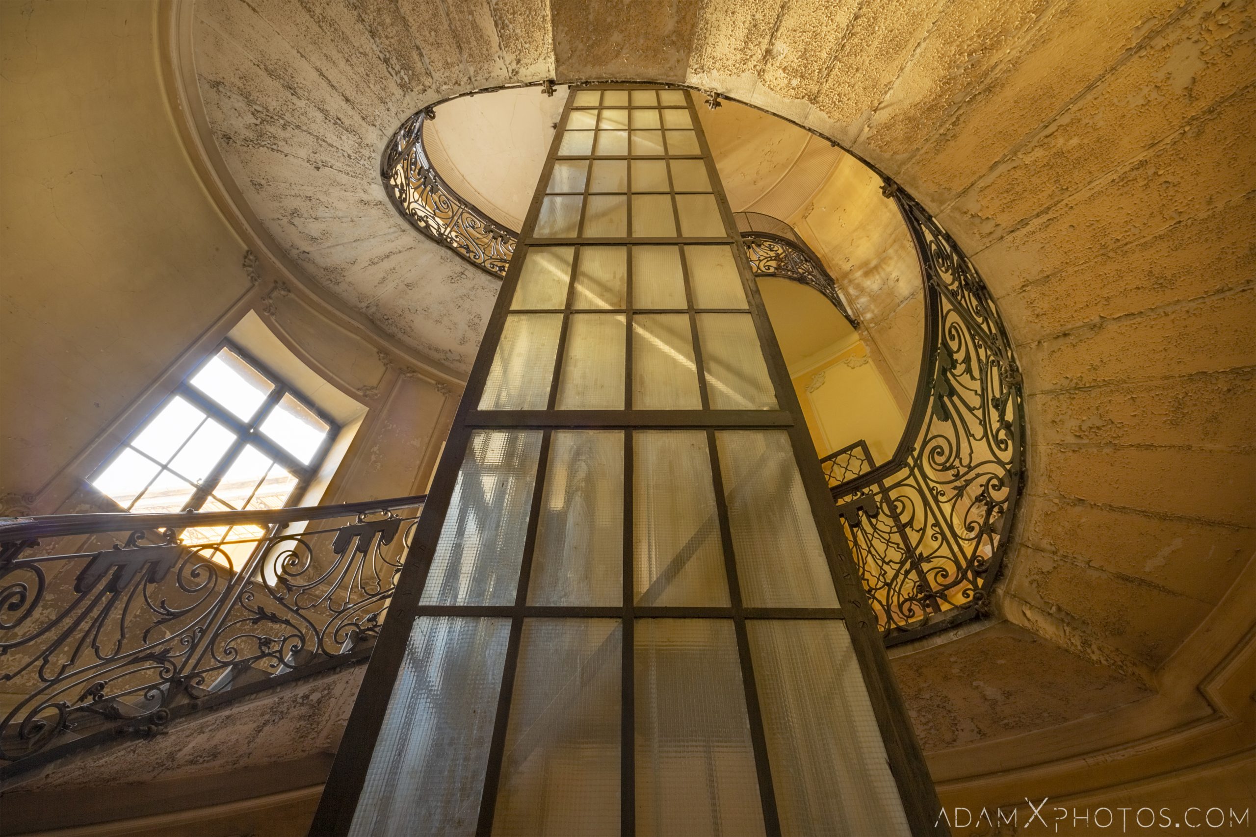 spiral staircase looking up lift Adria Palace Budapest Hungary Adam X Urbex Urban Exploration Access 2018 Blade Runner 2049 Abandoned decay ruins lost forgotten derelict location creepy haunting eerie security ornate grand neo baroque